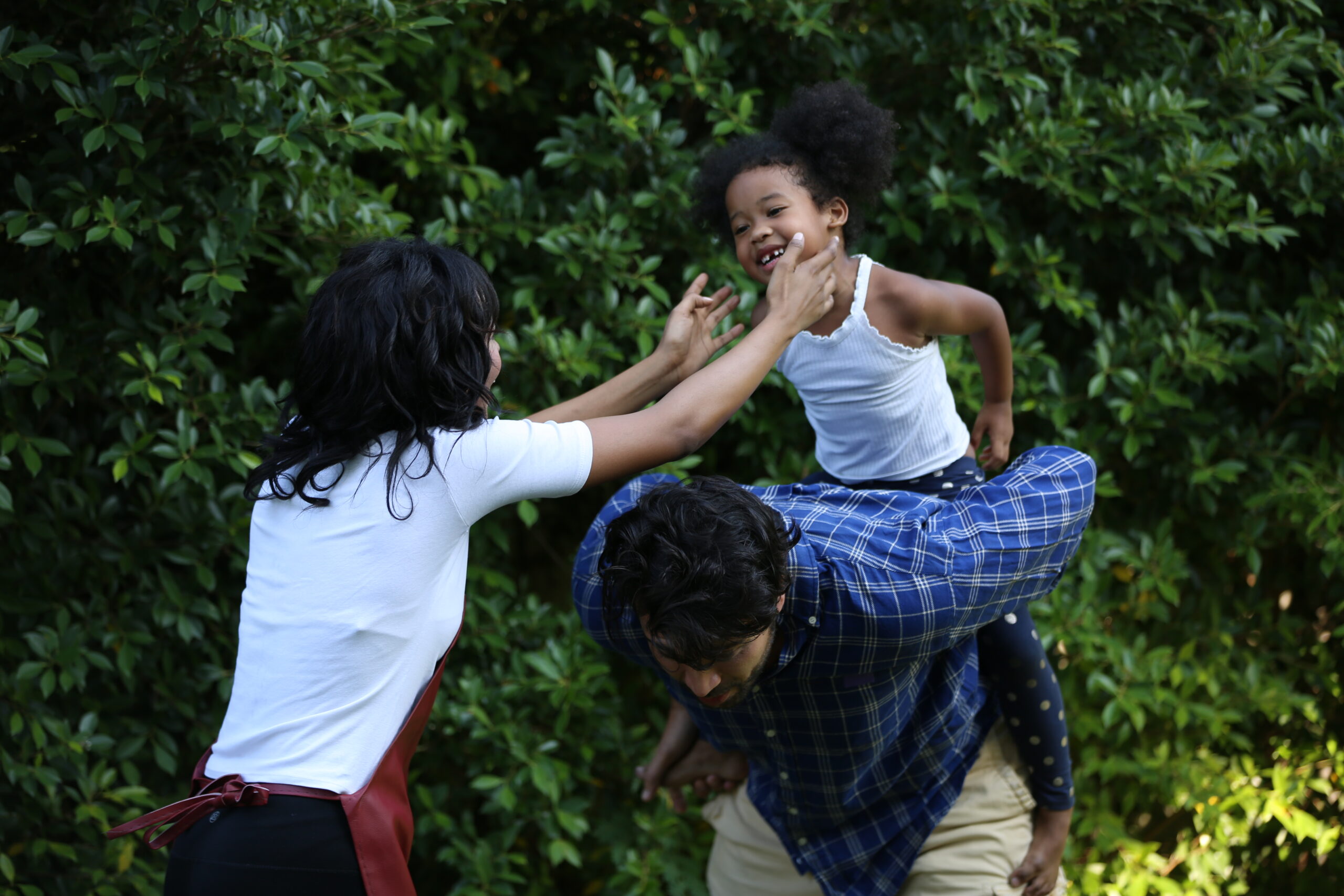 Multi generation black family in garden